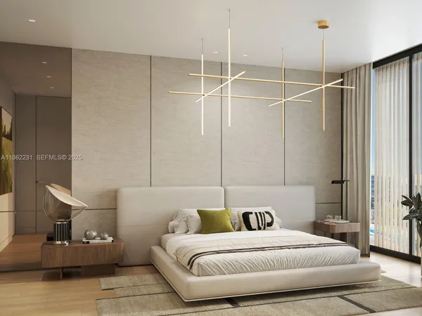 a bedroom with a bed and a chandelier