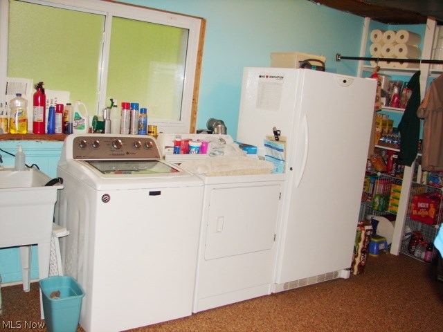 32 Boulder Ridge Place Painesville, OH 44077 - Photo 31 of 33 Laundry area has extra shelving for storage