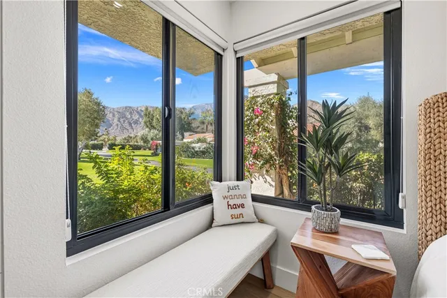 a living room with large windows