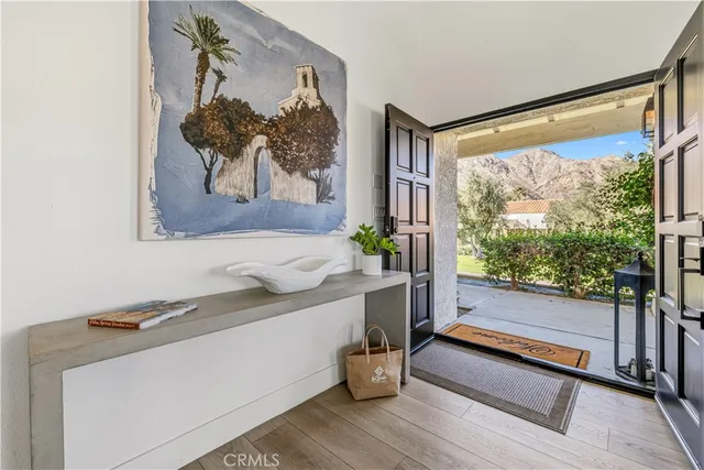 a bathroom with a tub and a large window
