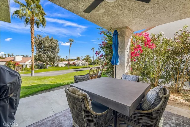 a view of a garden with an apartment