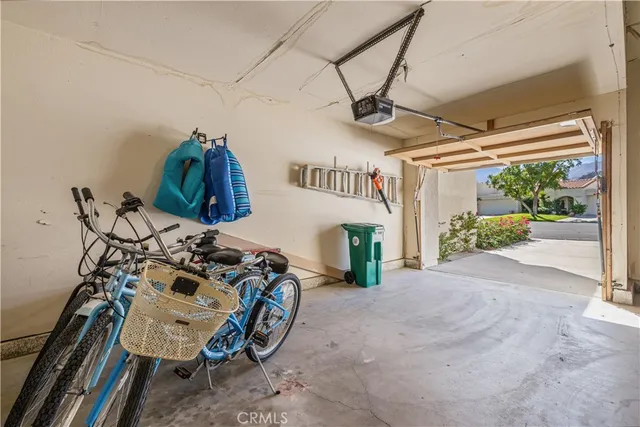a view of a house with a backyard and sitting area