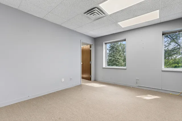 an empty room with windows