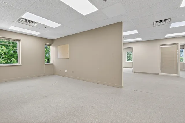 a view of an empty room with a window