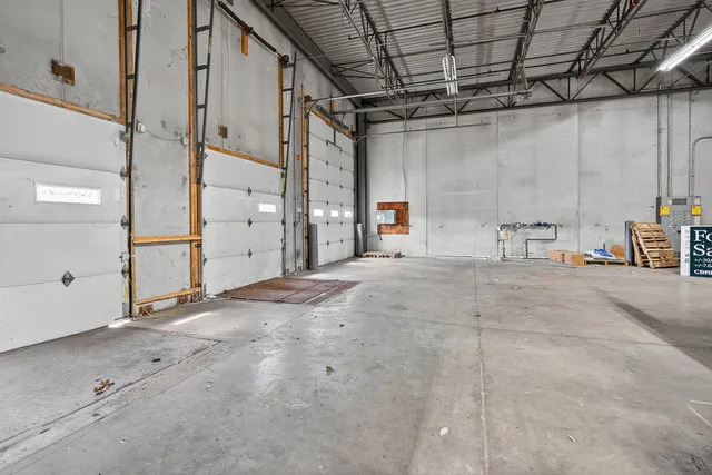 a view of empty room with wooden walls