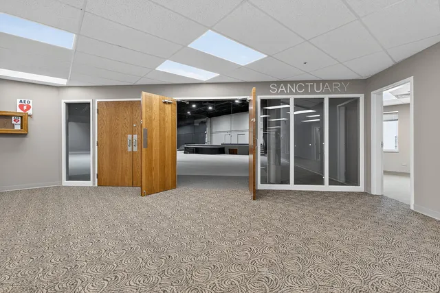 an empty room with furniture and closet