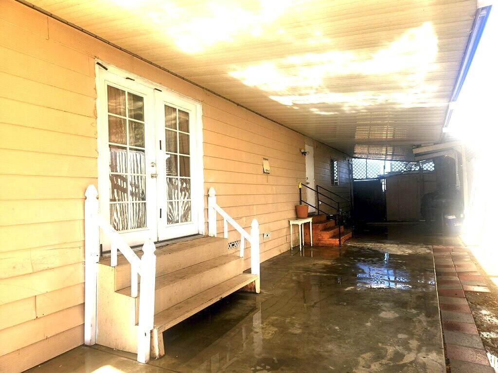 45800 Challanger Way Lancaster, CA 93535 - Photo 2 of 16 a view of a balcony with table and chairs