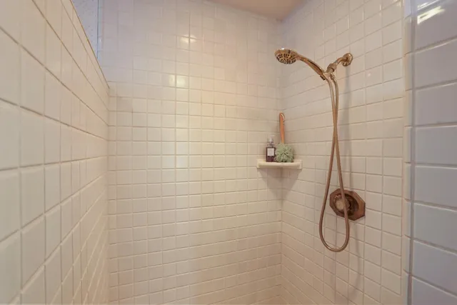 a white bath tub sitting in front of a bathroom