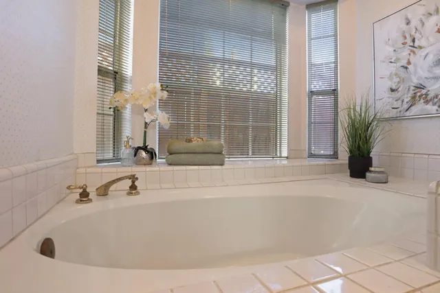 a bathroom with a walk in closet and bathroom