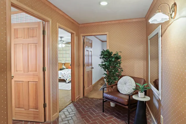 a dining room with furniture window wooden floor and a chandelier