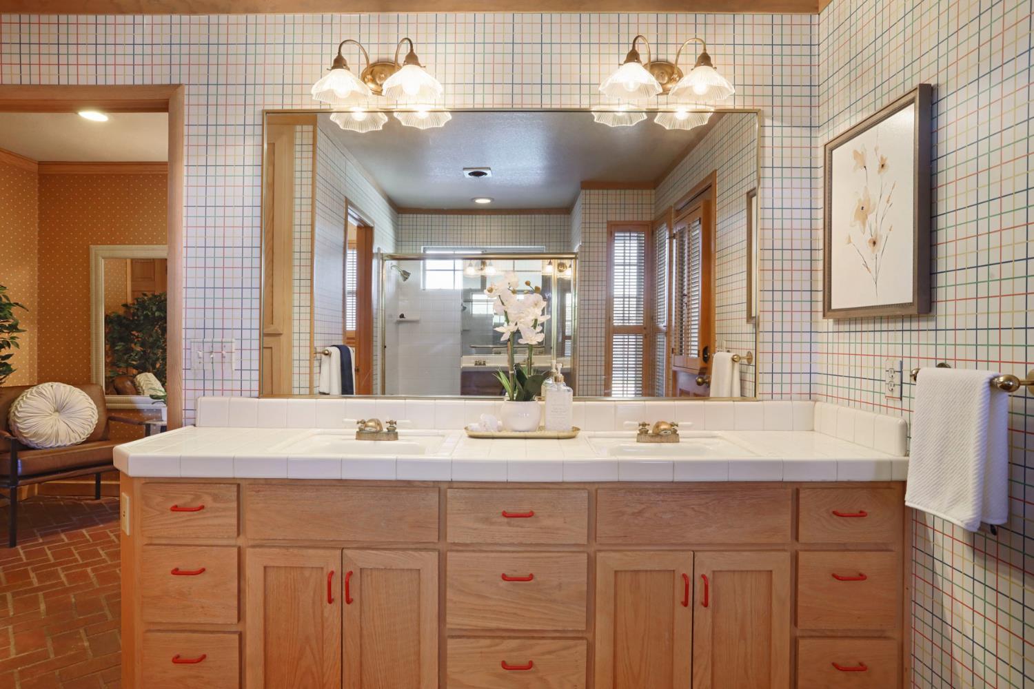 3152 Sea Gull Lane Stockton, CA 95219 - Photo 23 of 67 a bathroom with a sink double vanity and a mirror