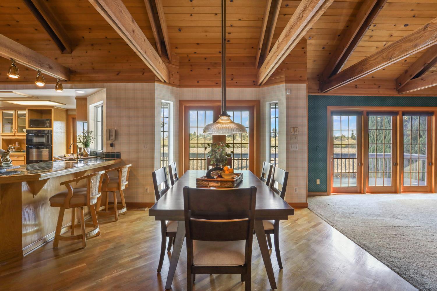 3152 Sea Gull Lane Stockton, CA 95219 - Photo 26 of 67 a dining room with furniture window wooden floor and a chandelier