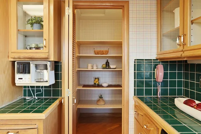a bathroom with a bathtub sink mirror vanity and toilet