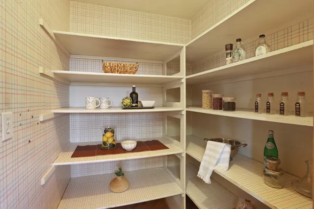 a room that has a bed and a chair in it