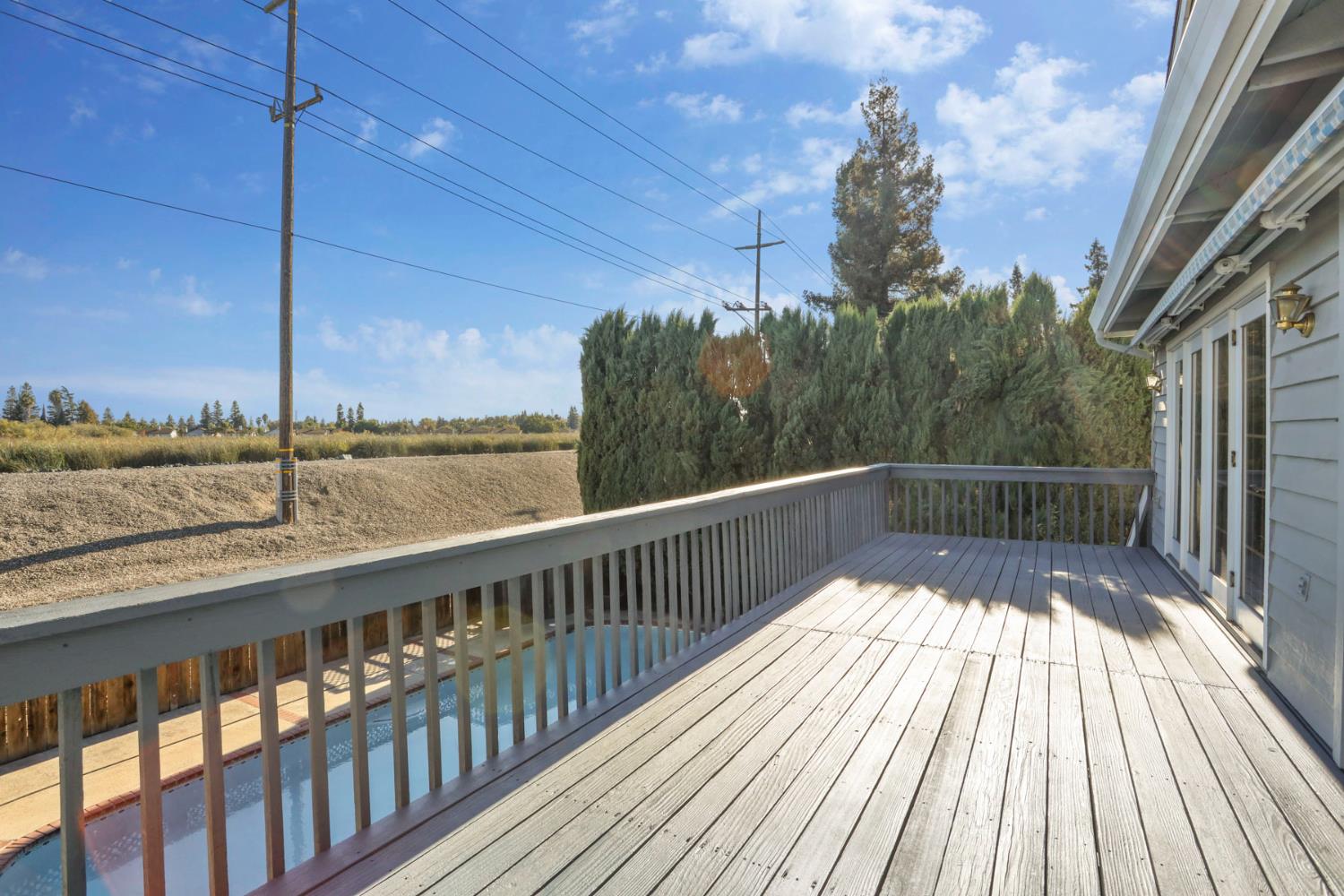 3152 Sea Gull Lane Stockton, CA 95219 - Photo 54 of 67 a view of balcony with wooden floor and fence with plants