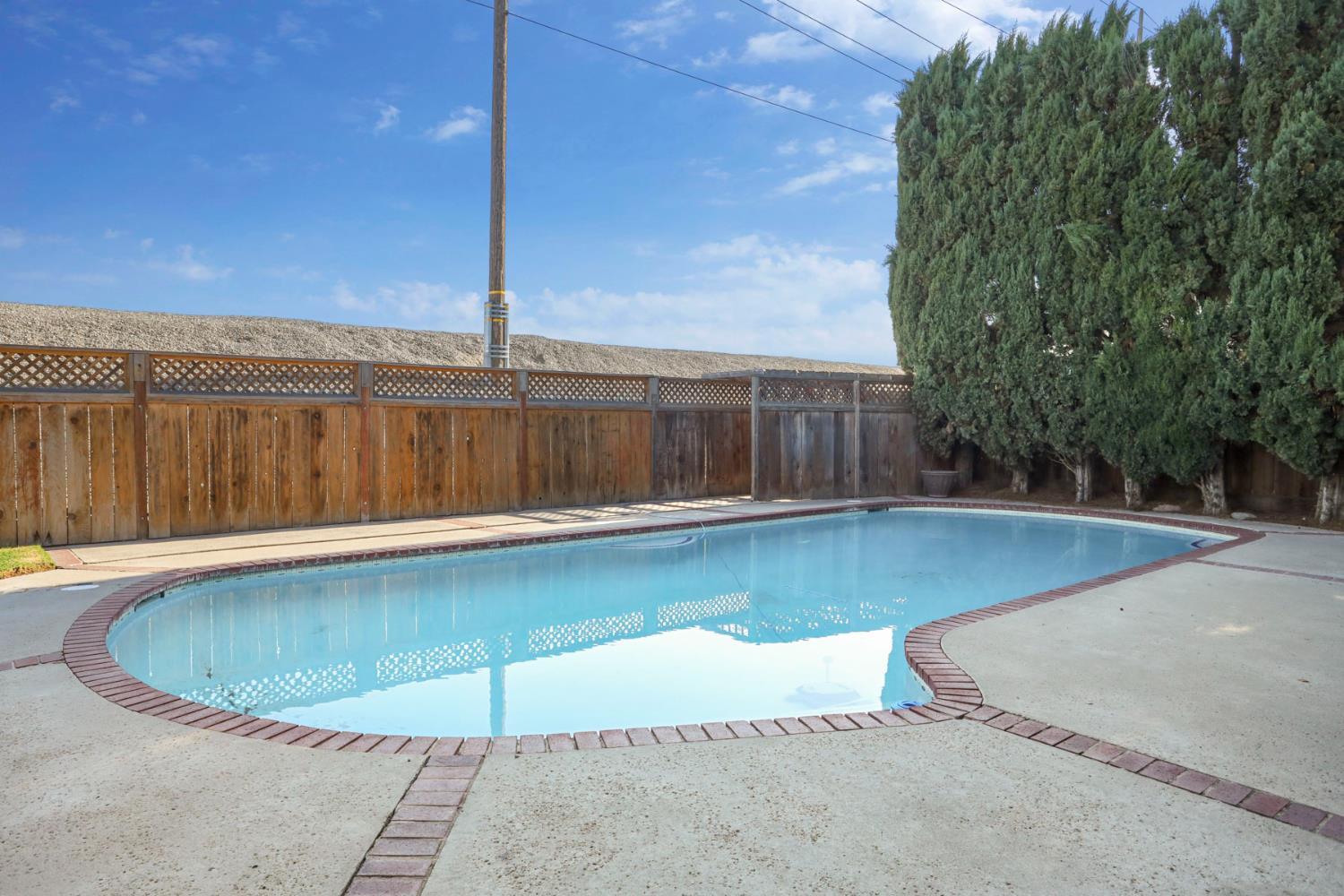 3152 Sea Gull Lane Stockton, CA 95219 - Photo 61 of 67 a view of a swimming pool with a patio