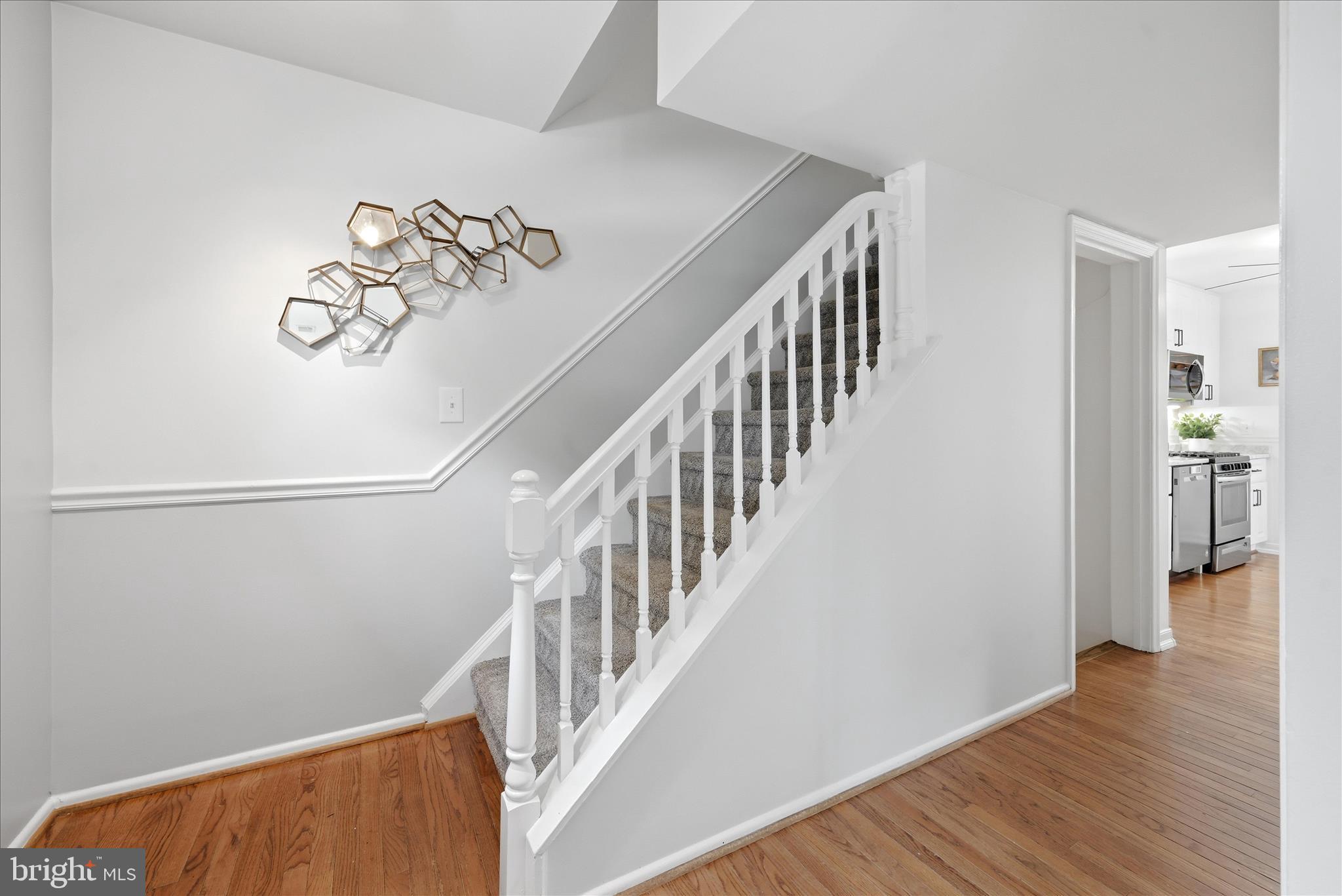 5446 Lighthouse Lane Burke, VA 22015 - Photo 12 of 36 a view of staircase with wooden floor