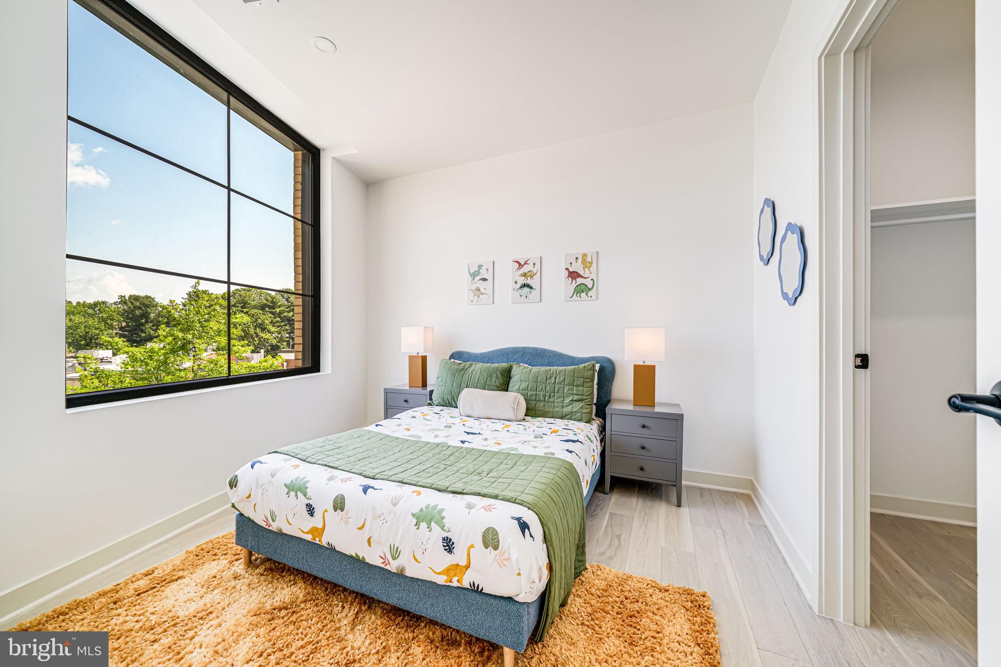 2903 Newark Street Northwest Washington, DC 20008 - Photo 12 of 36 a bedroom with a bed and window