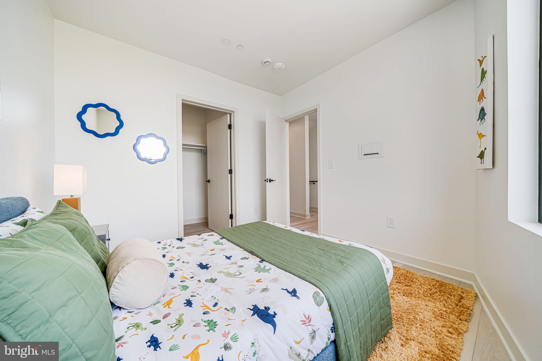 2903 Newark Street Northwest Washington, DC 20008 - Photo 14 of 36 a bedroom with a bed and a window