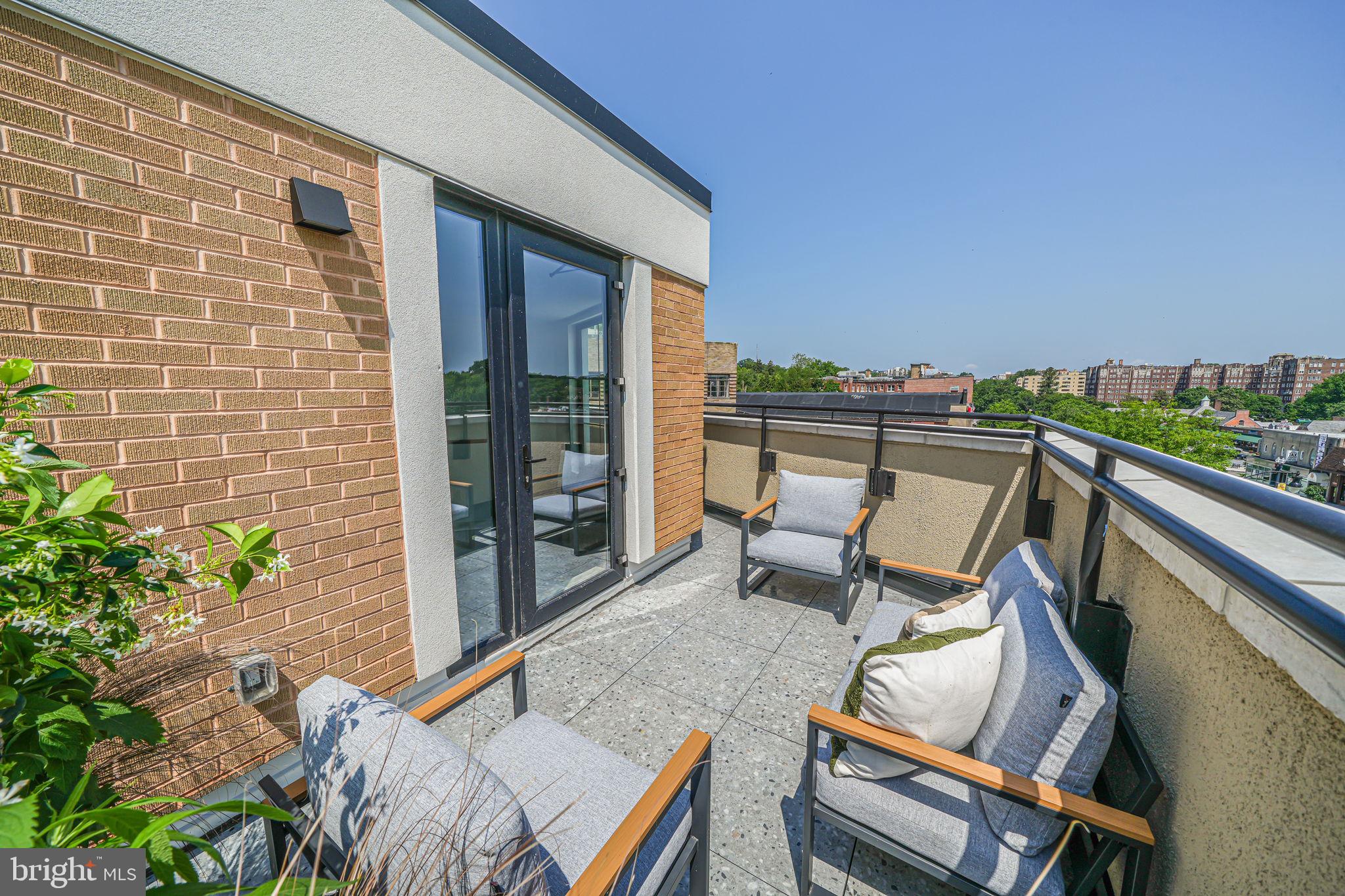 2903 Newark Street Northwest Washington, DC 20008 - Photo 22 of 36 a balcony with chairs and with potted plant