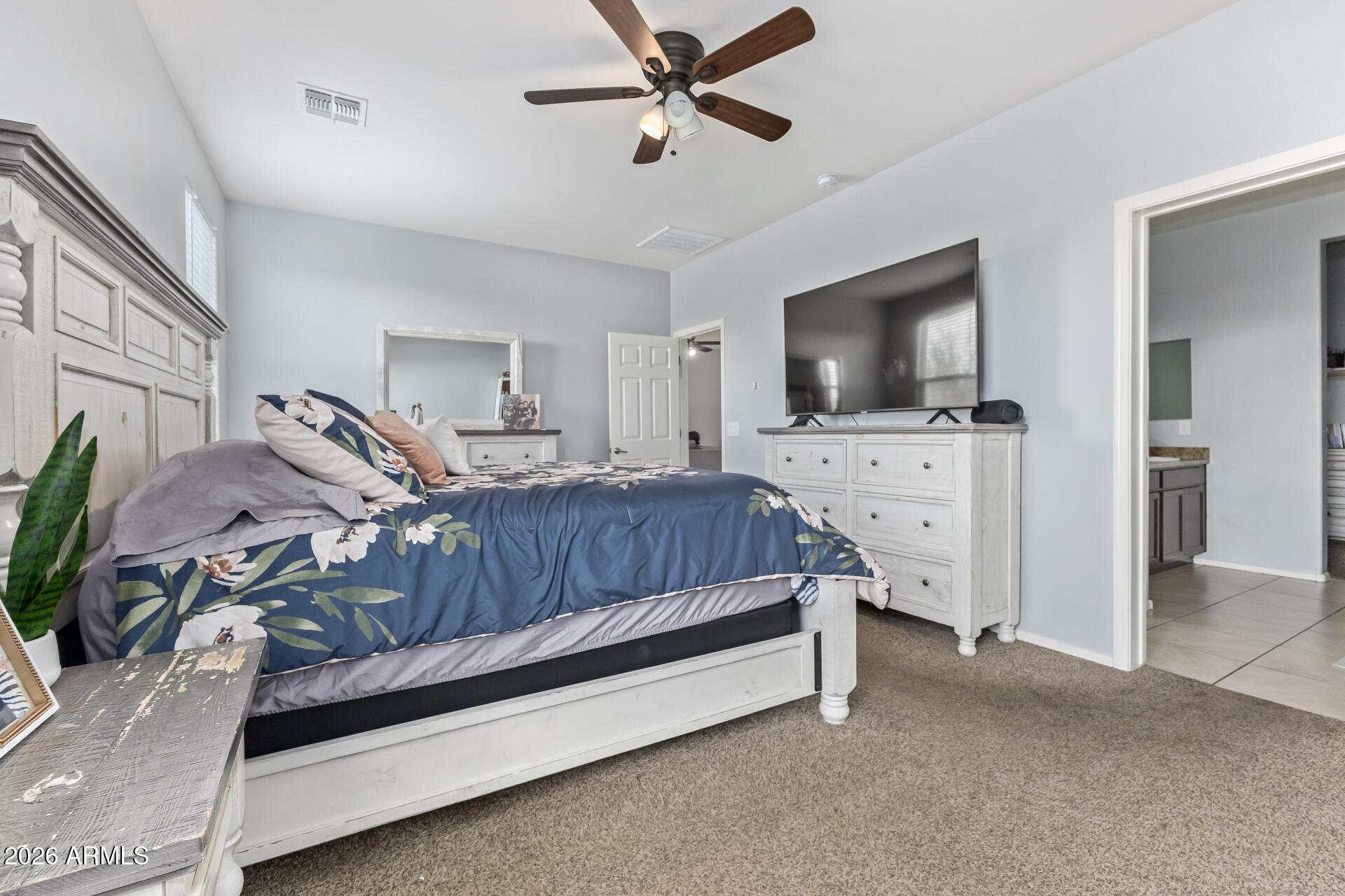 10326 West Payson Road Tolleson, AZ 85353 - Photo 14 of 27 a living room with furniture and a flat screen tv