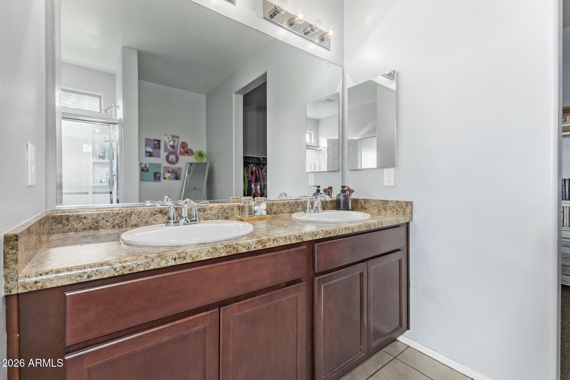 10326 West Payson Road Tolleson, AZ 85353 - Photo 15 of 27 a bathroom with a granite countertop sink and a mirror