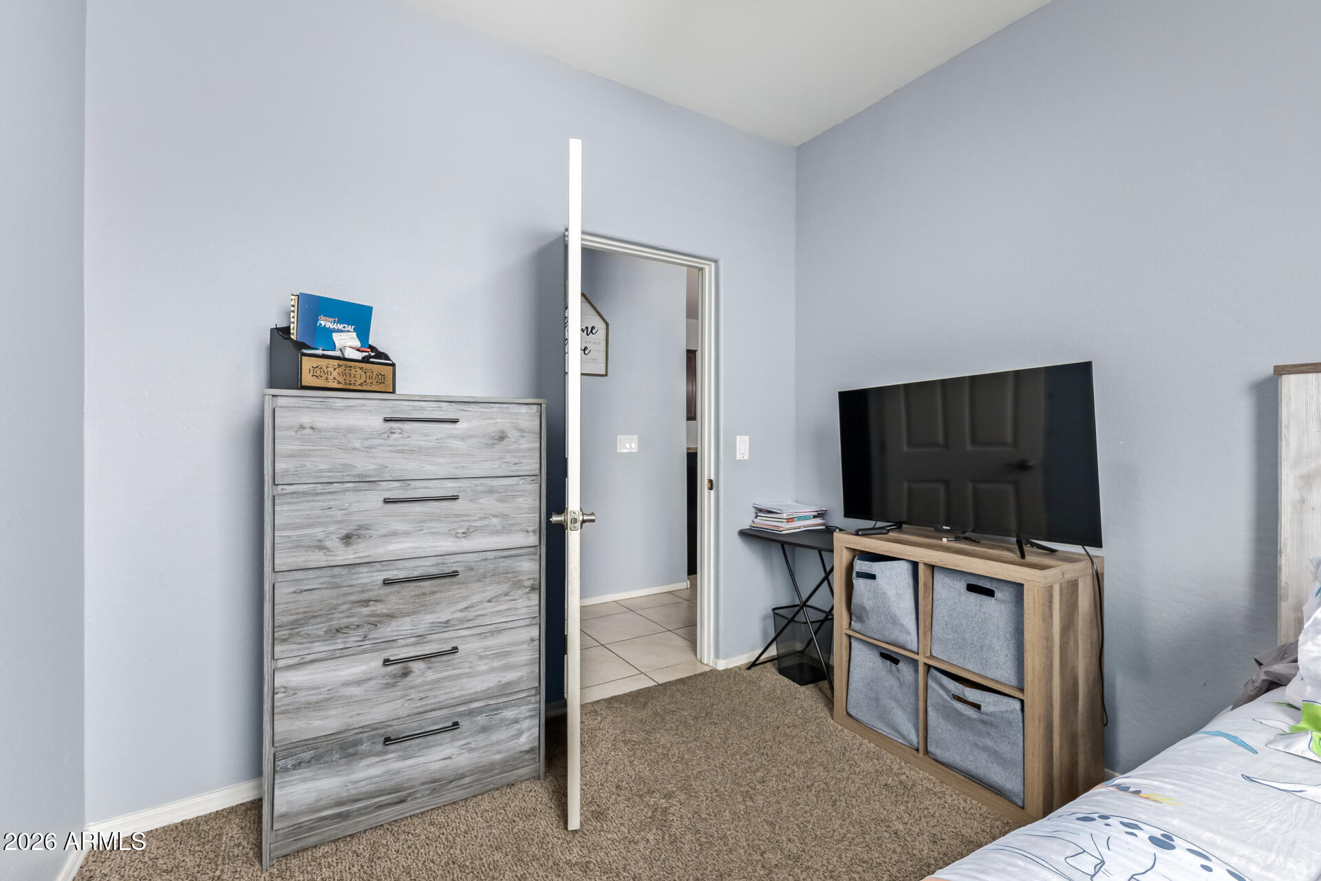 10326 West Payson Road Tolleson, AZ 85353 - Photo 18 of 27 a living room with furniture and flat screen tv