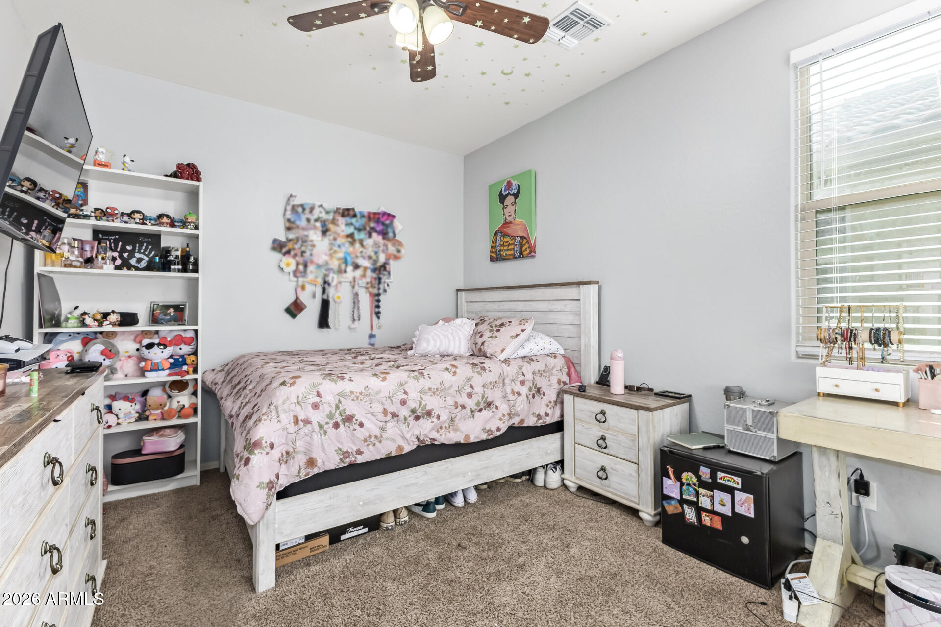 10326 West Payson Road Tolleson, AZ 85353 - Photo 20 of 27 a bedroom with a bed furniture and a window