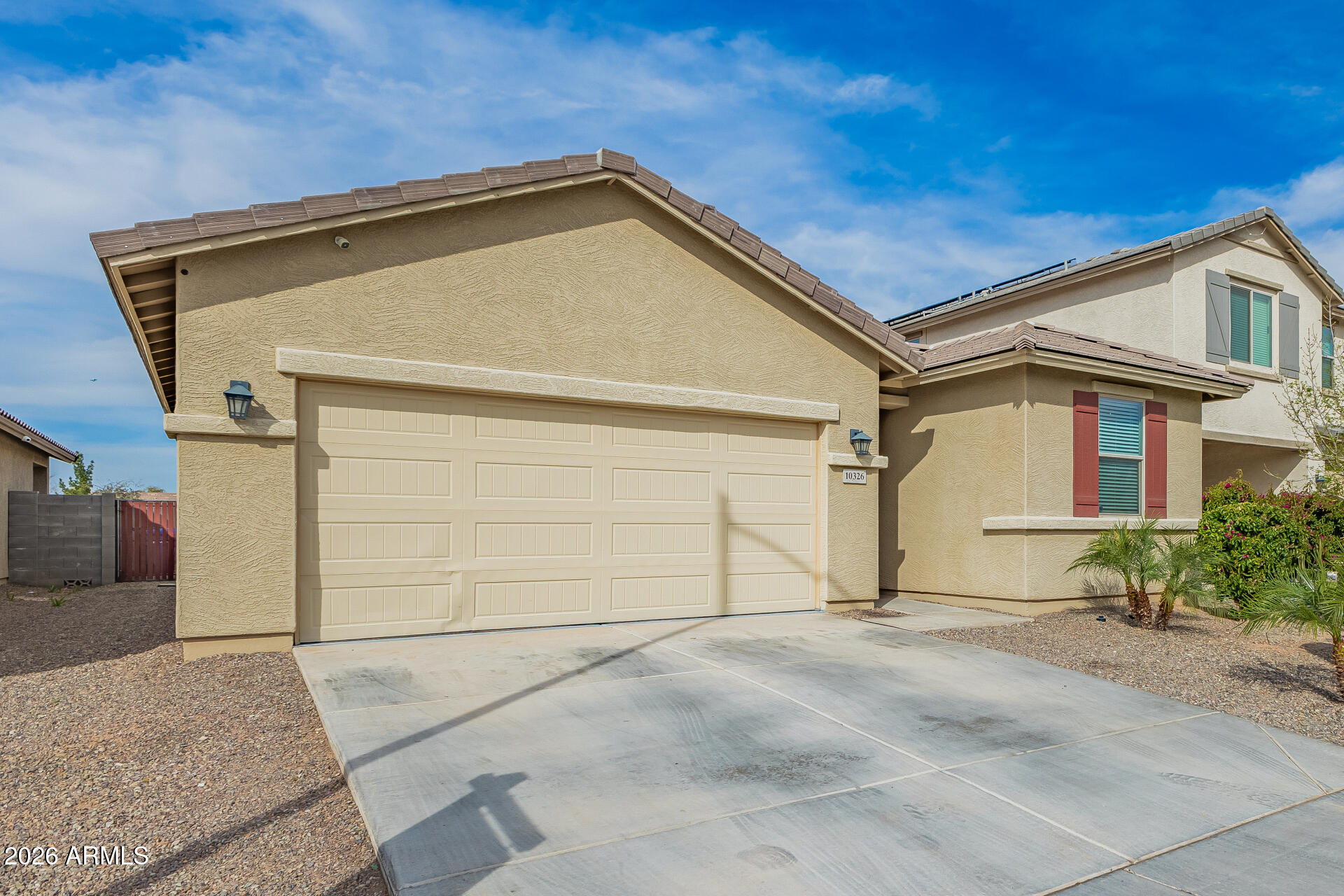10326 West Payson Road Tolleson, AZ 85353 - Photo 4 of 27 a view of a house with a garage