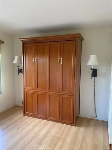 an empty room with wooden floor