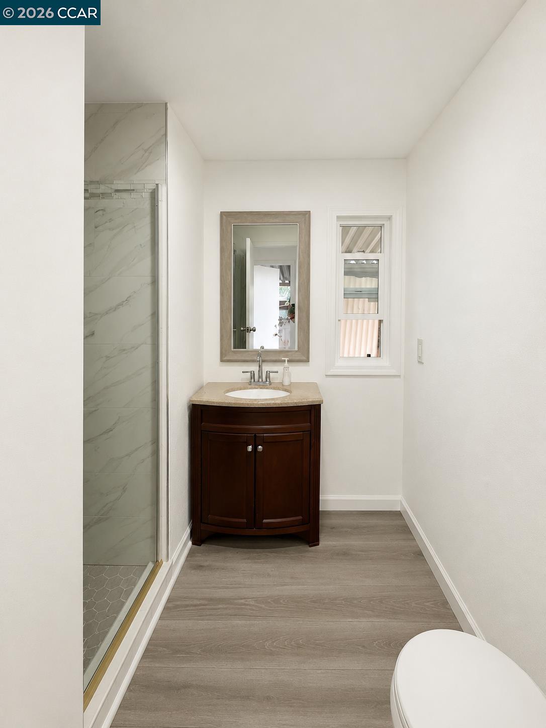 237 Orangevale Pittsburg, CA 94565 - Photo 13 of 21 a bathroom with a sink vanity mirror and toilet