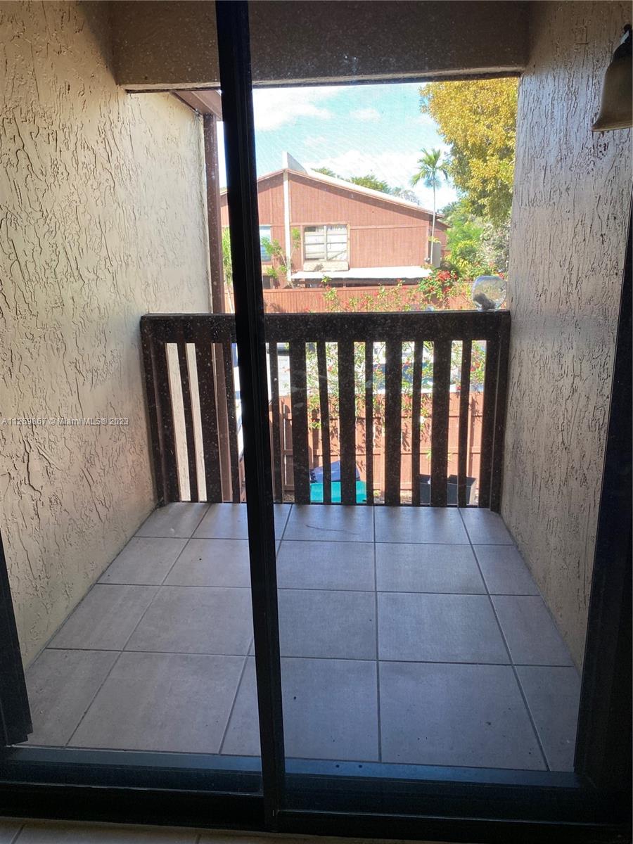 6934 Southwest 114th Place, Unit F55 Miami, FL 33173 - Photo 10 of 10 a view of an empty room with a window