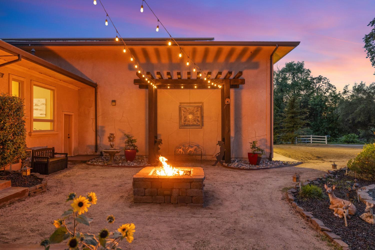 7021 Horseshoe Bar Road Loomis, CA 95650 - Photo 67 of 77 Private courtyard retreat with pergola seating, fire feature and a quiet evening under the stars.
