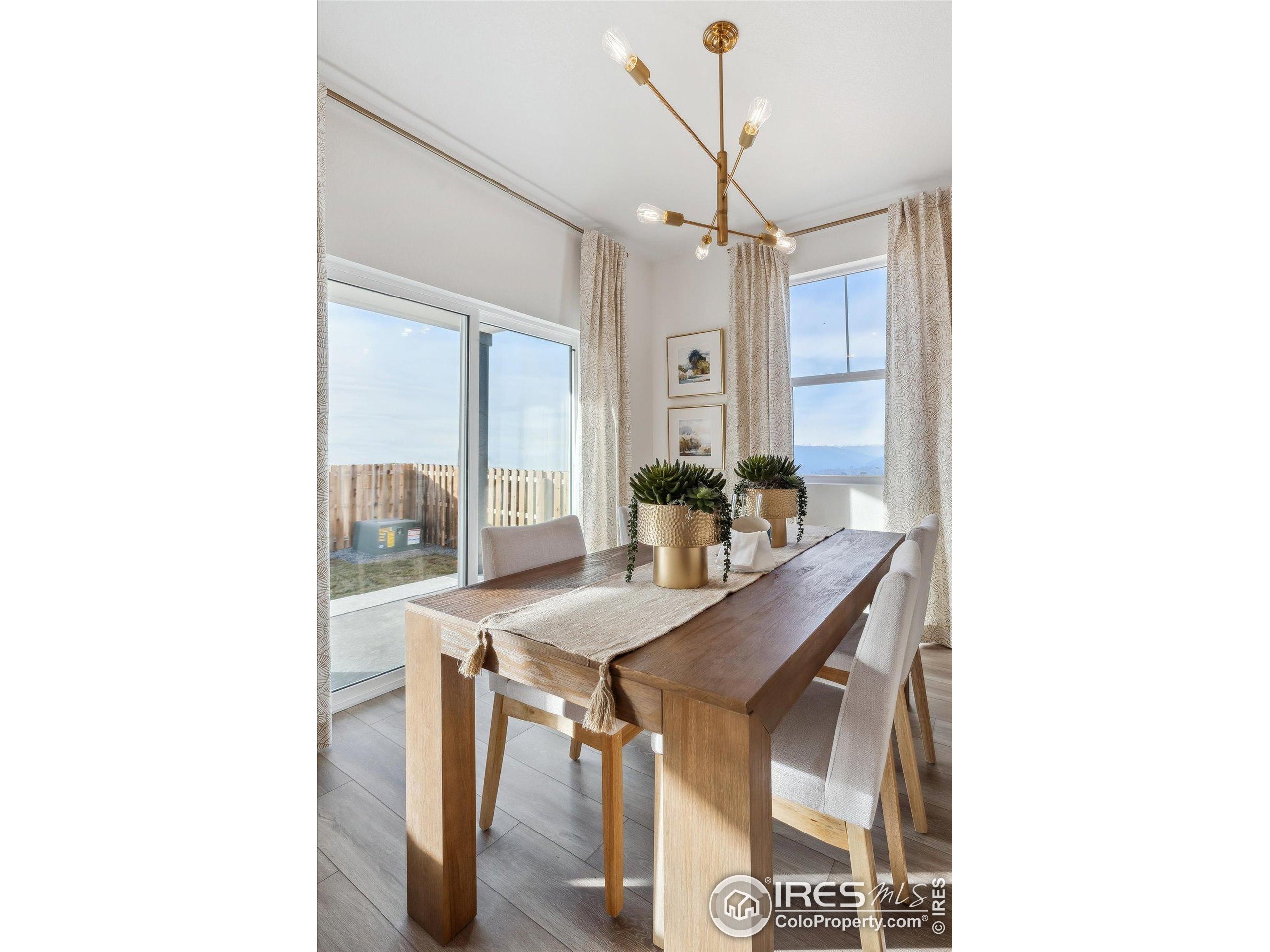 2207 Crosswind Street Fort Lupton, CO 80621 - Photo 12 of 26 a view of a dining room with furniture