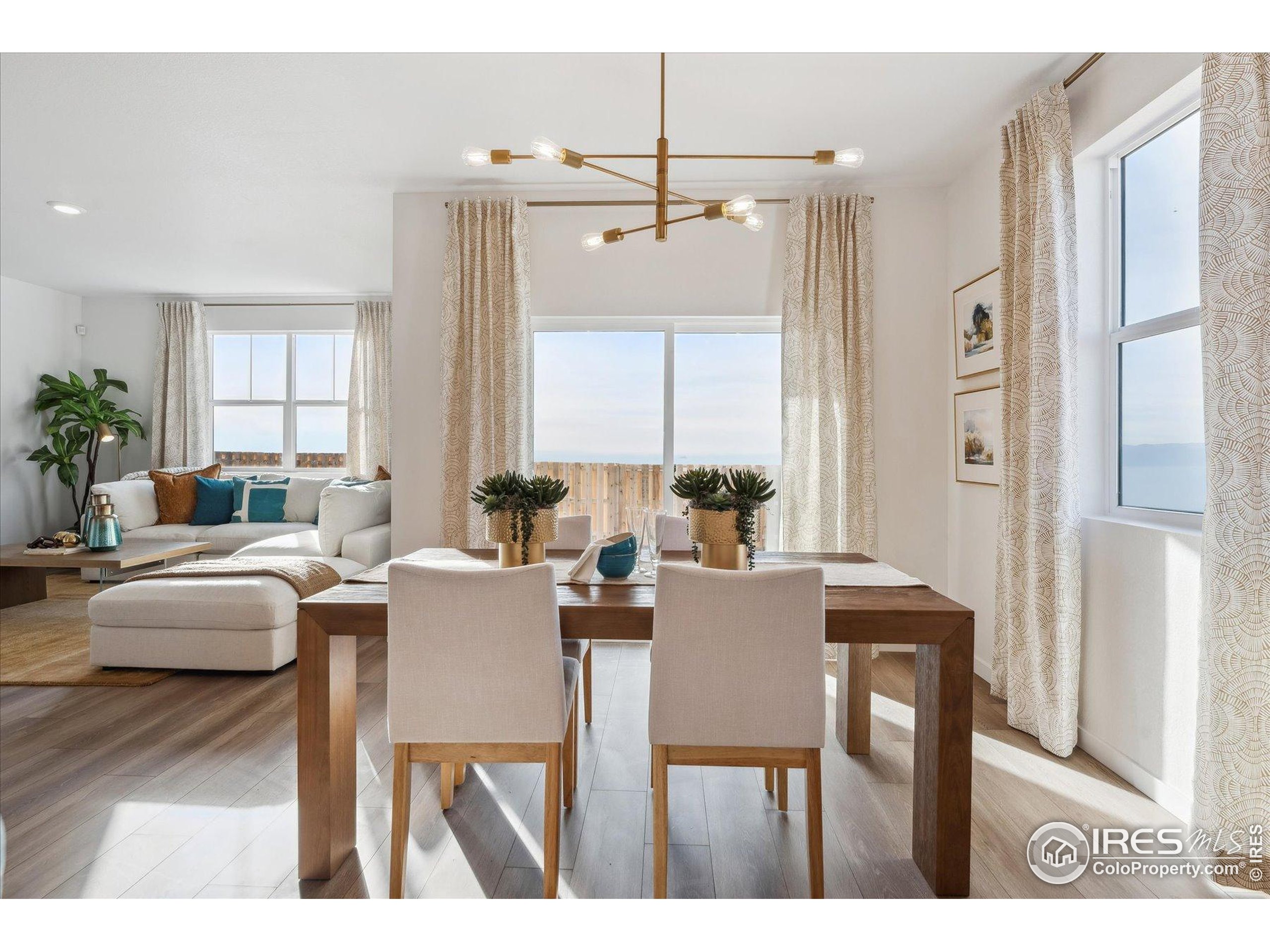 2207 Crosswind Street Fort Lupton, CO 80621 - Photo 10 of 26 a view of a dining room with furniture and window