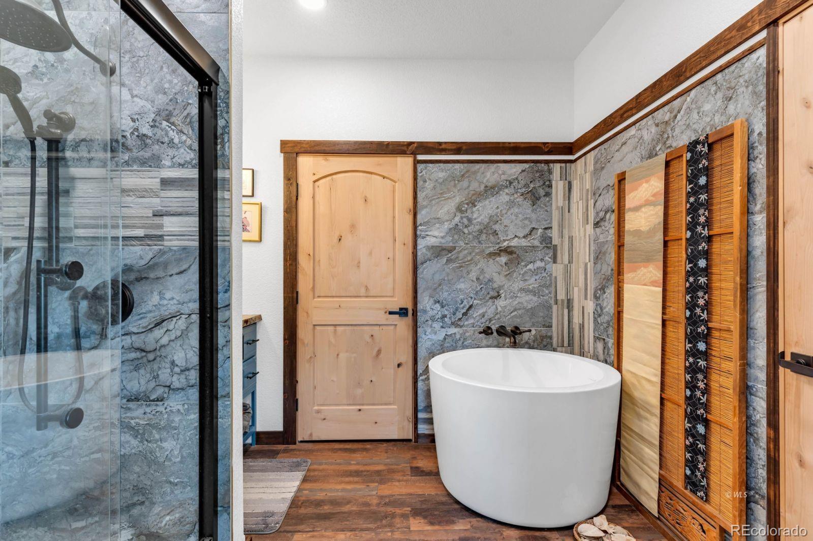 780 County Road 326 Westcliffe, CO 81252 - Photo 12 of 35 a bathroom with a bathtub and shower