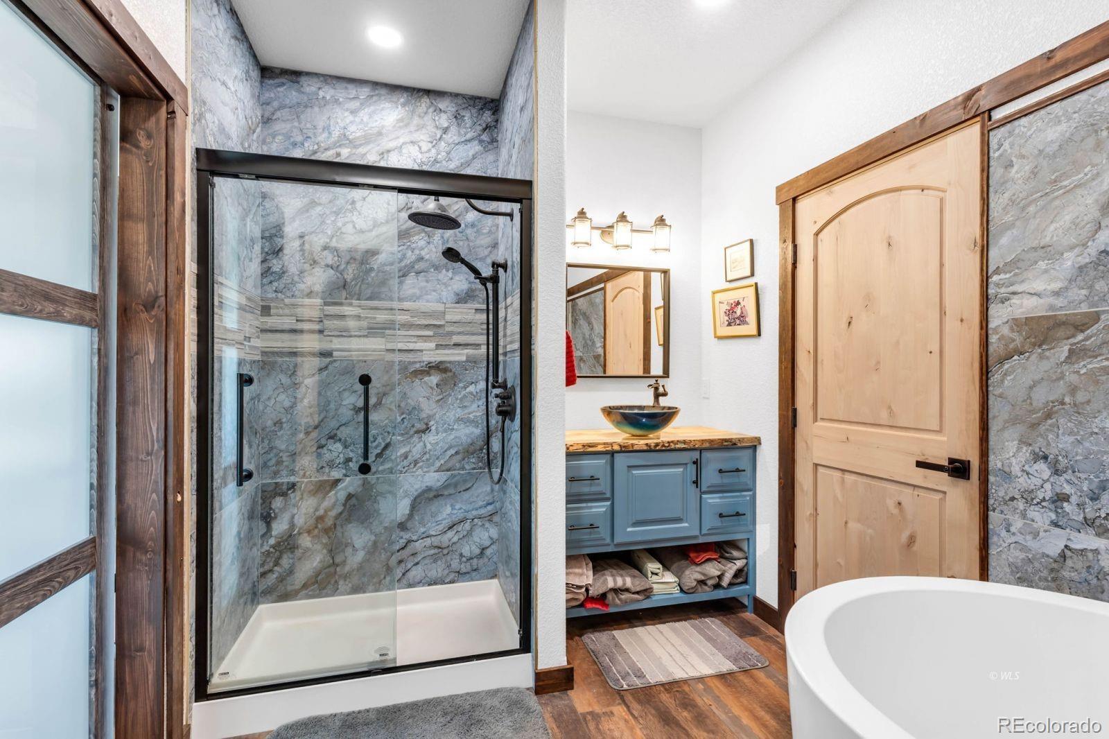 780 County Road 326 Westcliffe, CO 81252 - Photo 13 of 35 a bathroom with a tub and a shower