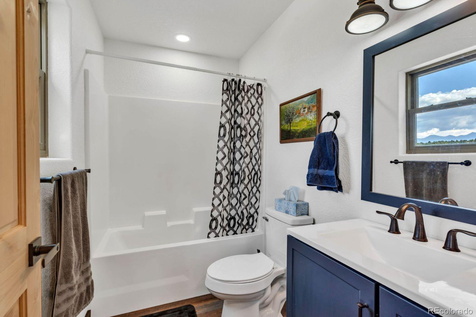780 County Road 326 Westcliffe, CO 81252 - Photo 22 of 35 a bathroom with a sink a toilet and shower