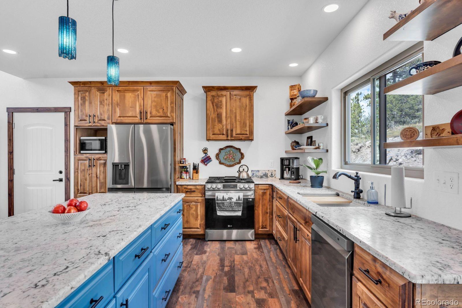 780 County Road 326 Westcliffe, CO 81252 - Photo 7 of 35 a kitchen with a sink stove and refrigerator