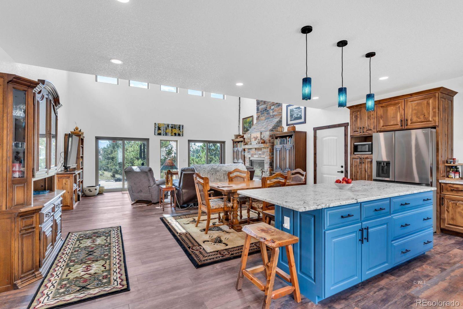 780 County Road 326 Westcliffe, CO 81252 - Photo 9 of 35 a very nice looking living room with a large window and kitchen view