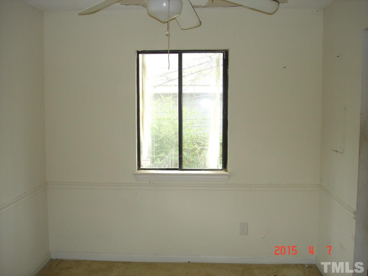 212 Bladen Street Raleigh, NC 27601 - Photo 5 of 9 an empty room with a window