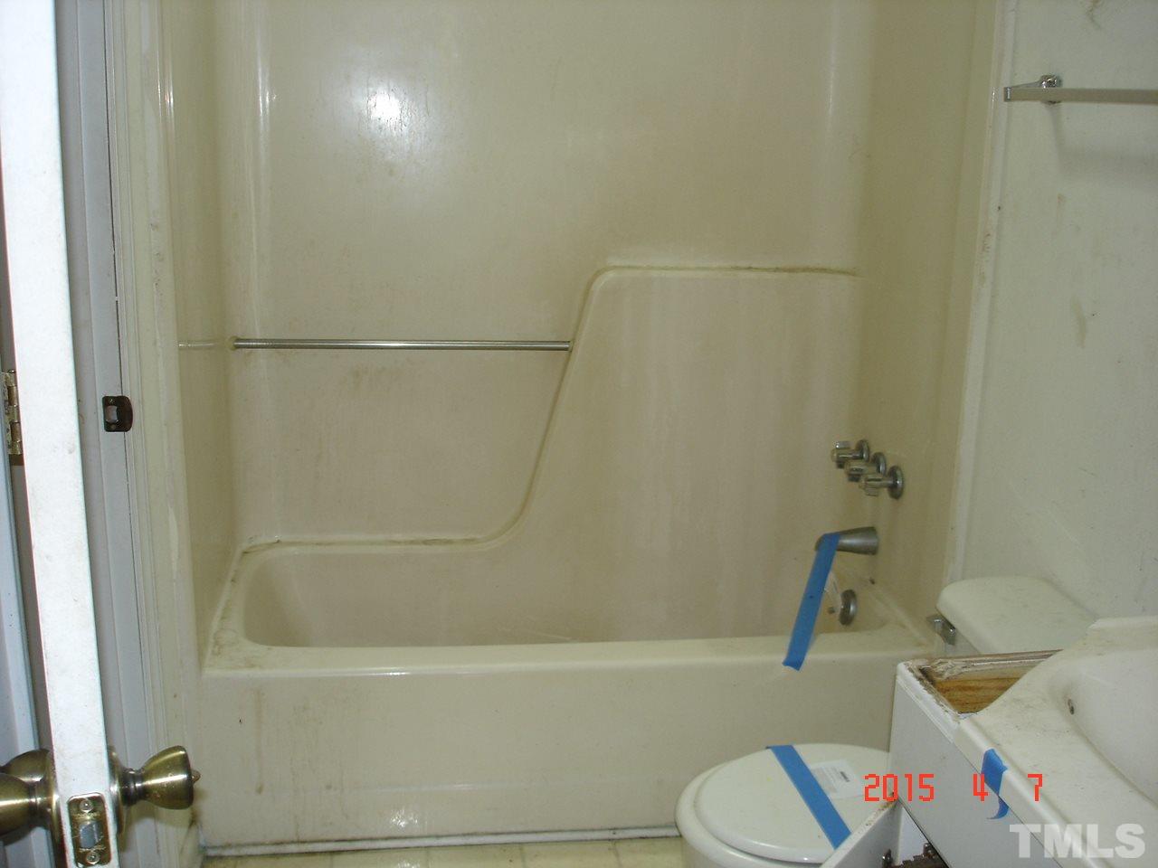 212 Bladen Street Raleigh, NC 27601 - Photo 8 of 9 a bathroom with a bathtub and a toilet
