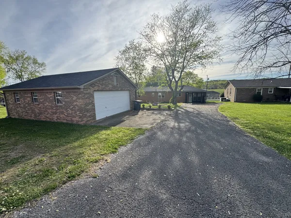 a view of a house with a back yard