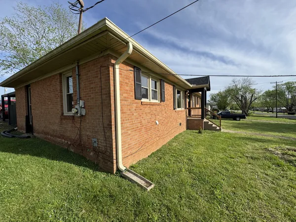 a backyard of a house with lots of green space
