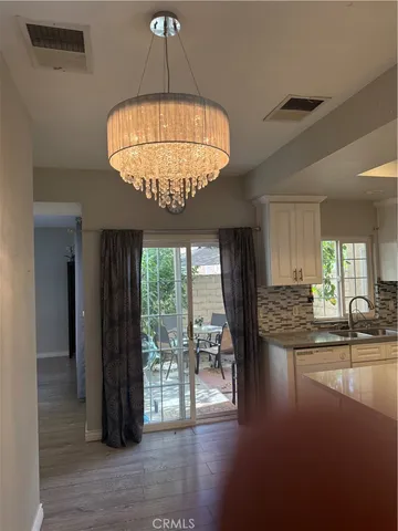 a bathroom with a sink a mirror and a toilet