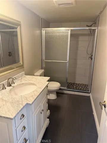 a view of work space with furniture and wooden floor