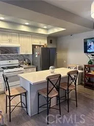 a kitchen with a table and chairs in it