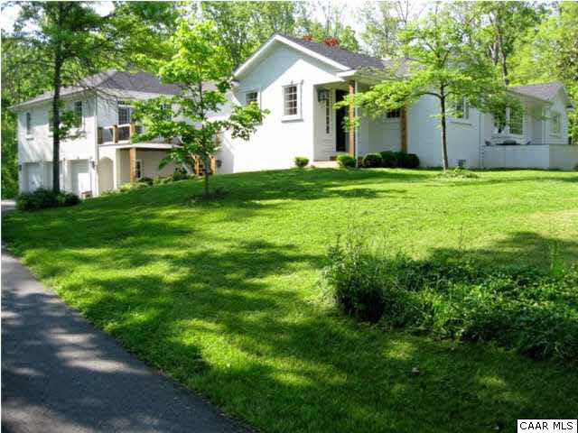 911 Tilman Road Charlottesville, VA 22901 - Photo 1 of 25 a front view of a house with a yard and trees