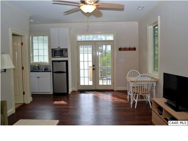 911 Tilman Road Charlottesville, VA 22901 - Photo 16 of 25 a living room with furniture and a flat screen tv