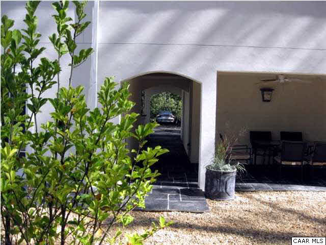 911 Tilman Road Charlottesville, VA 22901 - Photo 21 of 25 a front view of a house with lots of potted plants